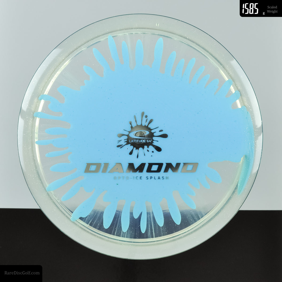 Latitude 64 Diamond easy to throw disc golf fairway driver in sparkle splash opto plastic, retailer exclusive, light blue.