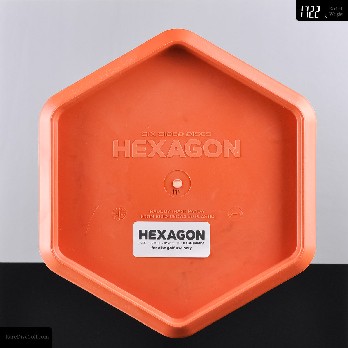 Six Sided Discs x Trash Panda swirly base hexagon recycled plastic disc golf object for throwing Rare Discs Canada Orange