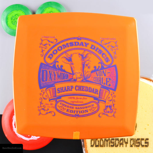 Doomsday Discs Oxymoron Cheese Sandwich bundle, Sharp Cheddar disc golf square novelty throwing object - with bread sponges, tomato and pickle minis. Package Photo